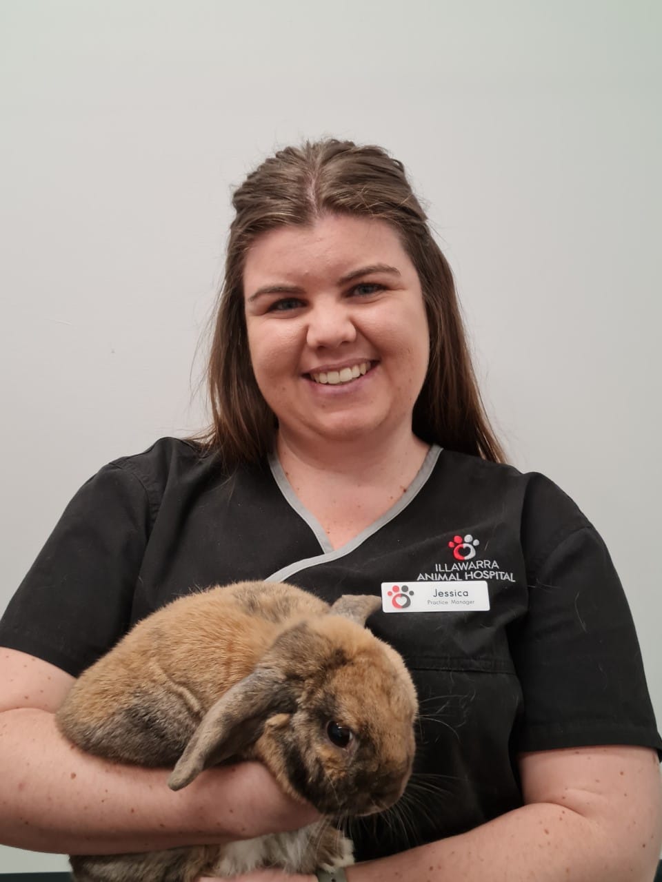 Woman Holding a Bunny at Vet Clinic